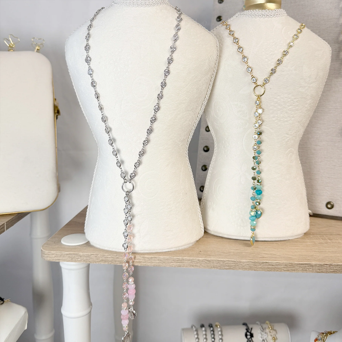 Love Lisa Alessia Amazonite and Quartz Heart Gemstone Drop Necklace with gold chain, featuring blue and clear heart-shaped gemstones.