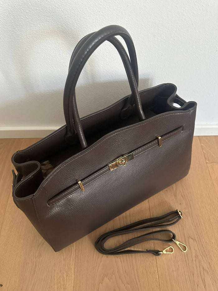 Genuine leather Amelia Big handbag by private label, stylish black leather handbag with sleek design and sturdy handles.