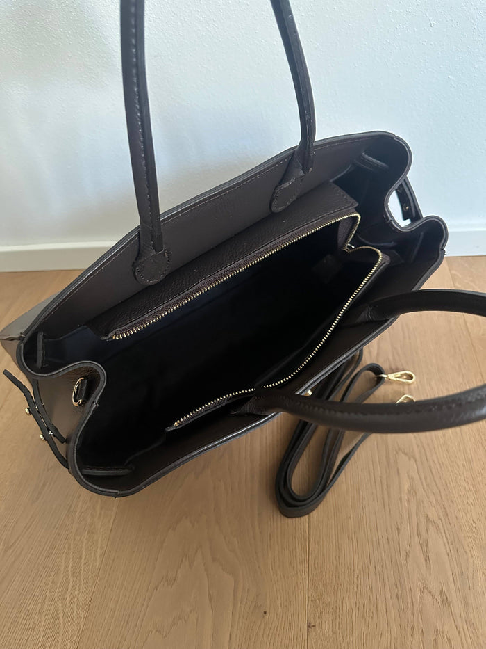 Private label Amelia Big genuine leather handbag with sturdy handles and sleek design, showcased in a close-up view.