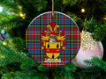 Bartholomew Scottish clan ceramic ornament with family crest on a Caledonia tartan background, hanging on a Christmas tree