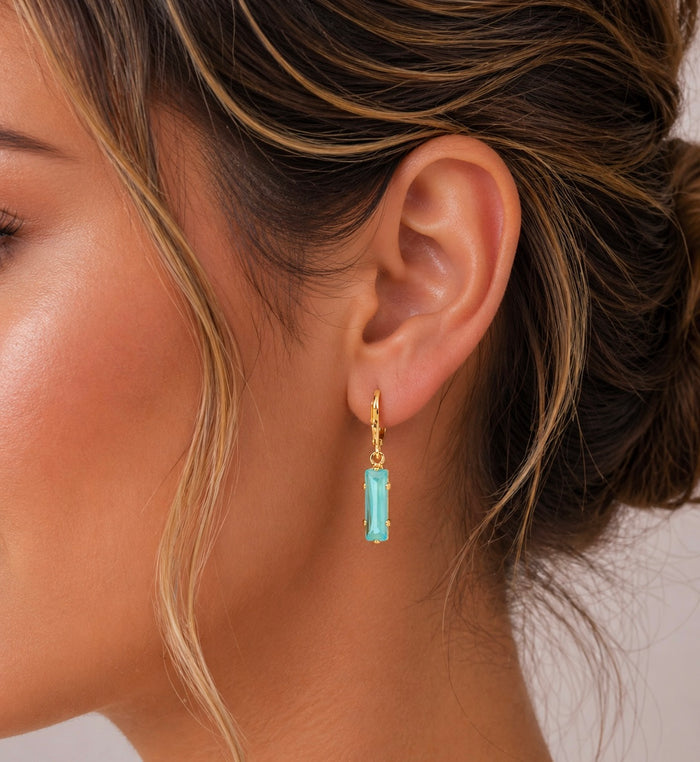 Sorrelli Bindi dangle earrings with intricate design and sparkling details, hanging from silver hooks.