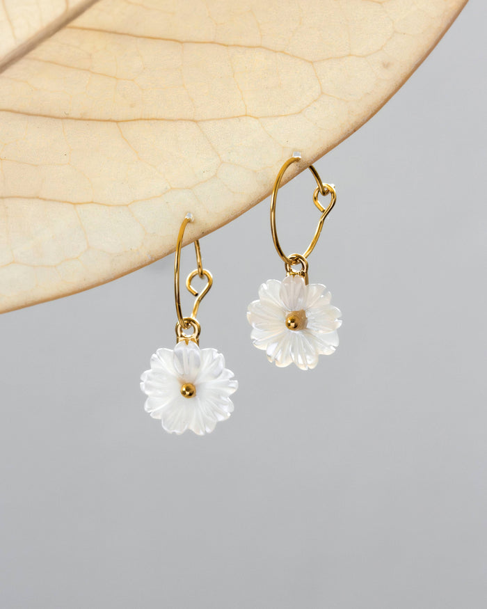 Luna Norte blooming hoop earrings featuring floral designs and elegant gold detailing.