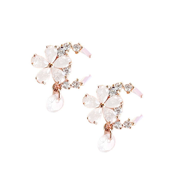 Celestial Blossom Dangle Stud earrings with intricate floral design and elegant dangling feature in a close-up view.