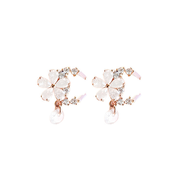 Celestial Blossom Dangle Stud earrings featuring intricate floral designs and elegant dangle style in a close-up view.