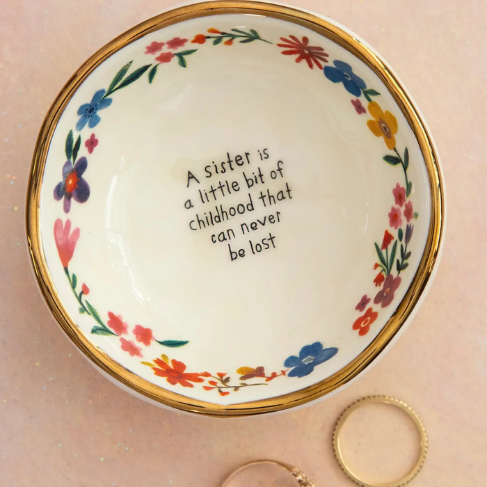 Natural Life ceramic giving trinket bowl with sister childhood design, featuring colorful, playful artwork on a small decorative dish.