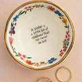 Natural Life ceramic giving trinket bowl with sister childhood design, featuring colorful, playful artwork on a small decorative dish.