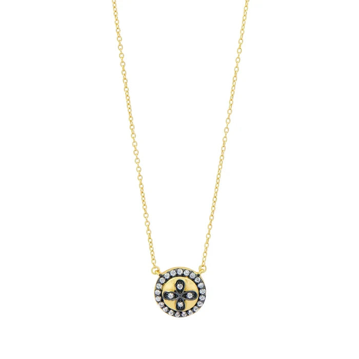 Gold and black Clover Necklace by Freida Rothman with intricate clover design and elegant chain detail.