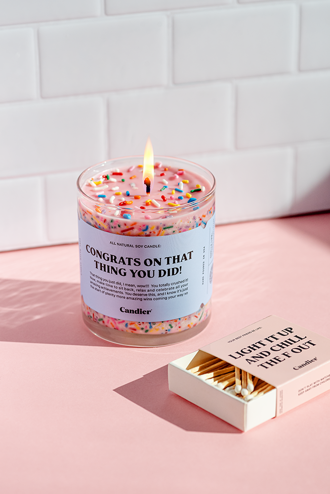 Candier congratulation candle with a white wax finish and "Congrats" inscription, perfect for celebrations and special occasions.