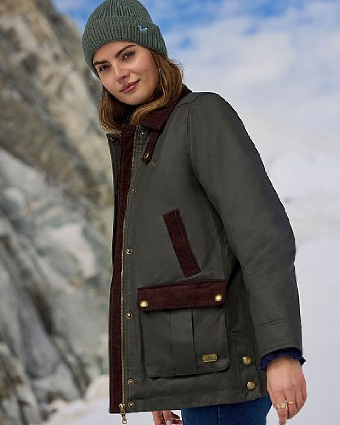 Green Coloured Crew Clothing Womens Wax Jacket on outdoor background #colour_green