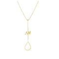 A delicate gold Y-necklace featuring a small 'AM' initial pendant and a teardrop-shaped dangling loop, shown on a plain white background.