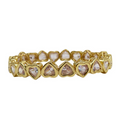 Dainty 18k gold heart gems bracelet by La Lumiere NY featuring delicate gold chain and sparkling gemstone accents.