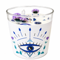 Private label Evil Eye soy wax candle with decorative design, showcasing a vibrant blue eye symbol on a candle holder.