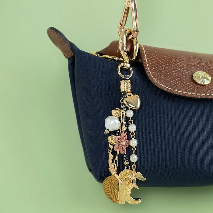 Free-Spirited Western Cowgirl Bag Charm featuring a rustic design and vibrant colors, perfect for accessorizing bags.