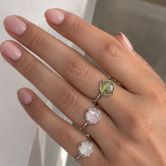 Silver oval gemstone ring with adjustable band, featuring a sparkling crystal centerpiece and crafted by Private Label.