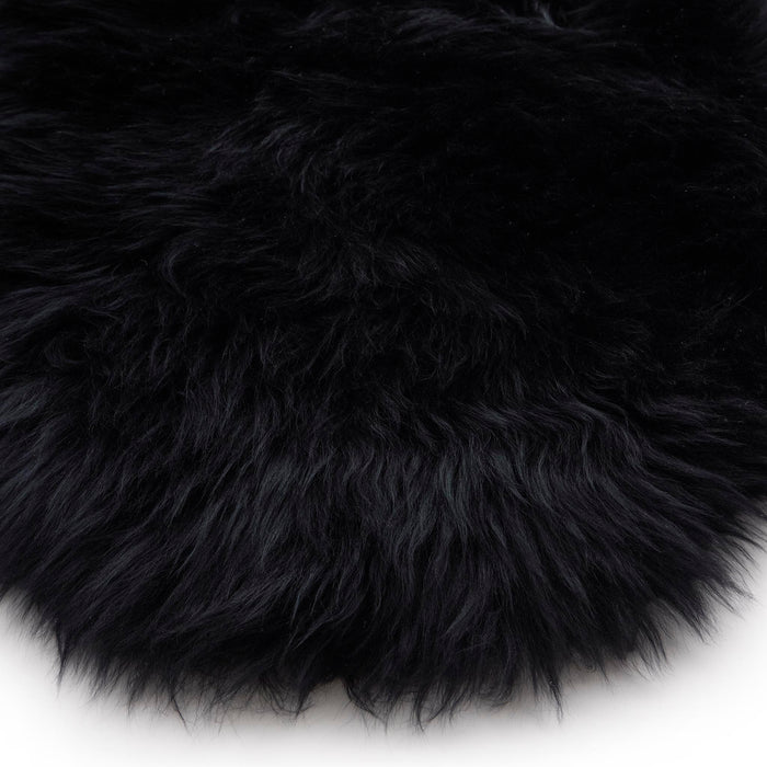 Close-up of Double Sheepskin Black Rug made up of long-haired wool.