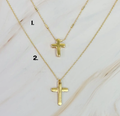Gold cross necklace from Ellison + Young featuring a sleek, polished cross pendant on a delicate chain.