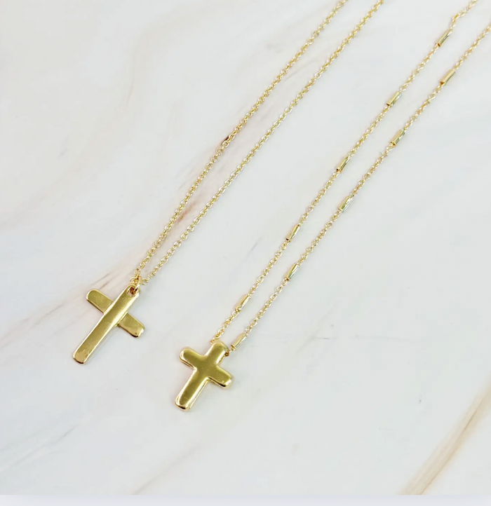 Gold cross necklace from Ellison + Young featuring a delicate pendant on a fine chain, stylish and elegant jewelry accessory.