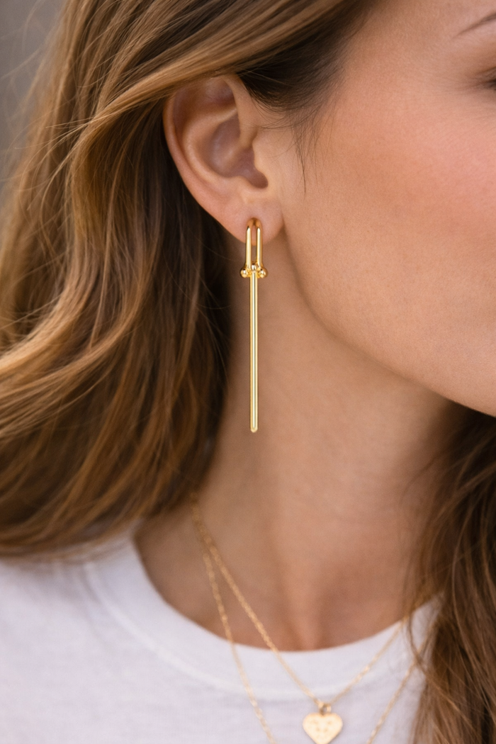 Stylish hardware earrings by Private Label featuring a unique design and metallic finish, ideal for any outfit.