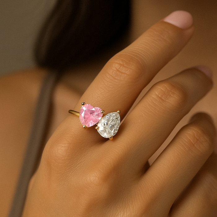 Heart and pear-shaped CZ adjustable ring in silver, showcasing a delicate design and sparkling gemstones.
