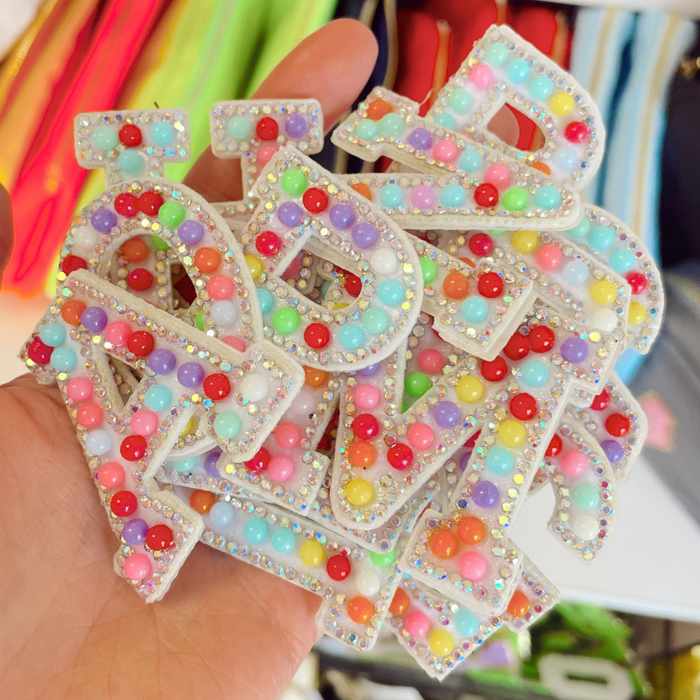 Multicolor initial sticker patches by Lil Darlings, featuring various letters and vibrant designs for creative embellishments.