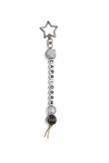 Jules by the Sea Zodiac keychain featuring a circular pendant with zodiac symbols on a silver-tone keychain.