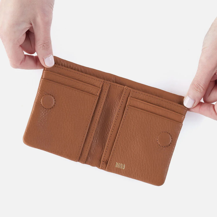 HOBO Lumen Mini Wallet featuring compact design with card slots and sleek black leather finish.