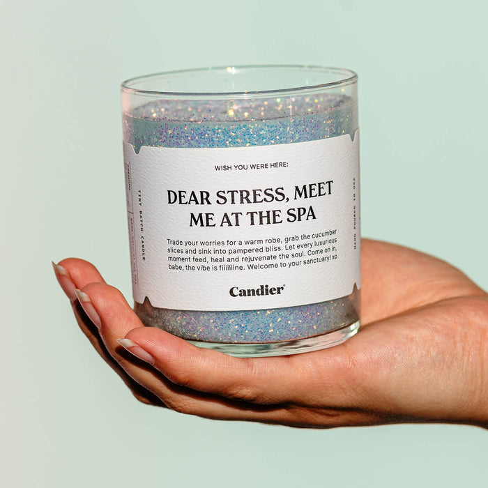 Candier Meet Me At The Spa candle with a white container and label, ready to create a relaxing spa atmosphere.