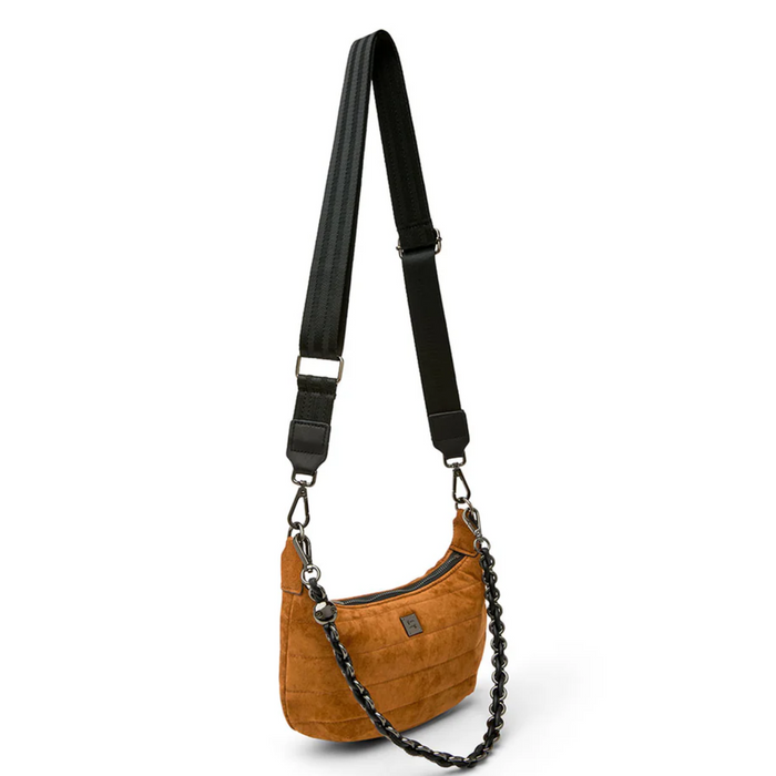 Think Royln Mini Moon handbag in a stylish design, showcasing its unique shape and color against a neutral background.