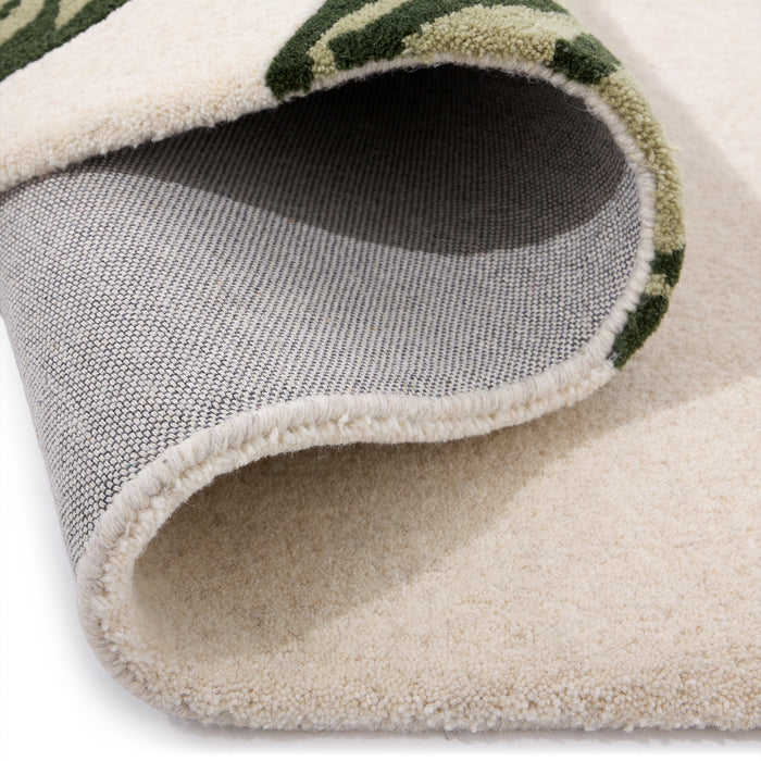 Discover the Paradise Leaf Rug- 100% wool cut pile rug in cream with a leaf design.