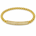 Gold pave bar single bracelet by The Skylar Project featuring beaded design and diamond-studded clasp on a white background.