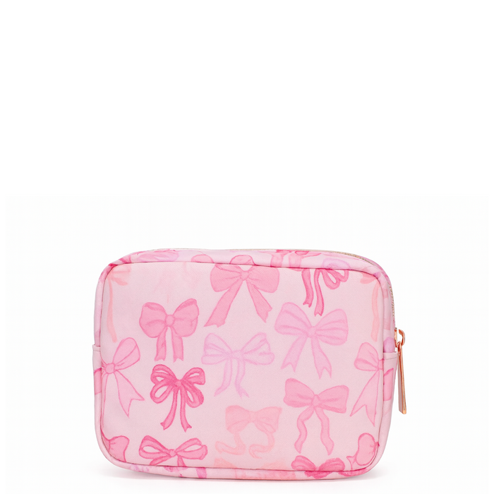 Pink nylon bow makeup bag by Lil Darlings, stylish storage for cosmetics with a cute bow detail and spacious interior.