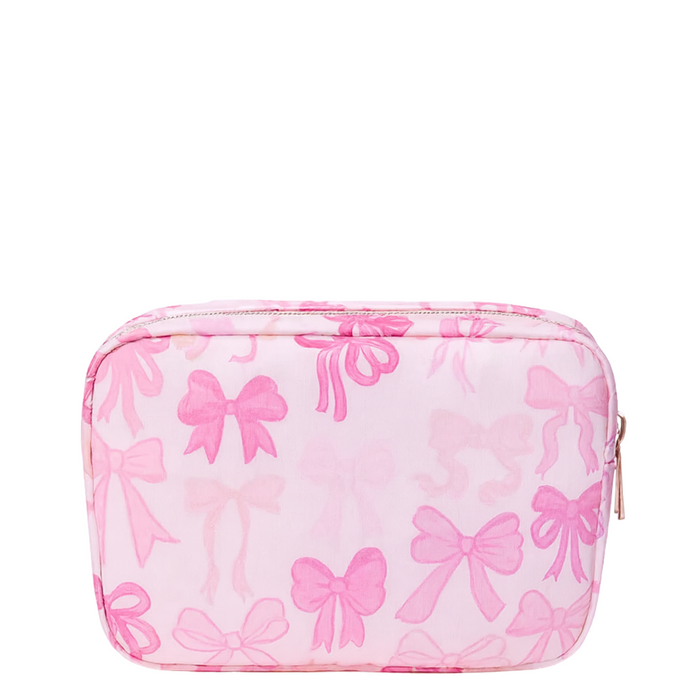Pink nylon bow makeup bag by Lil Darlings with a stylish bow detail and spacious interior for cosmetics and beauty essentials.