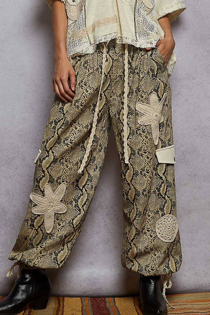 Pol Clothing pleat detail floral patchwork cargo pants with stylish pleats and floral patches on lightweight fabric.