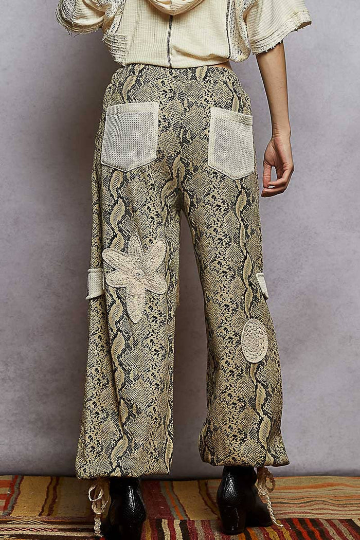 Pol Clothing pleat detail floral patchwork cargo pants with relaxed fit and vibrant floral patterns, casual and stylish for everyday wear.