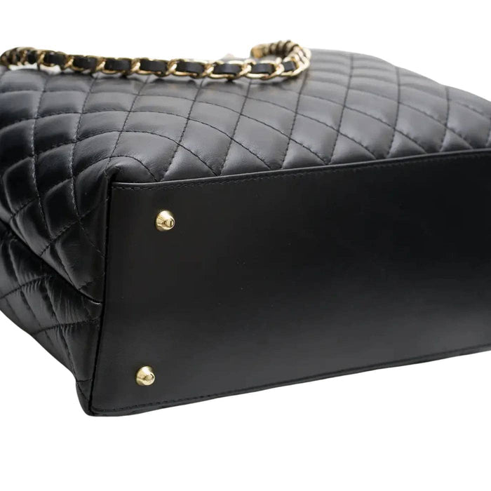 Quilted genuine leather tote handbag with top handles, featuring a sleek, structured design and subtle brand detailing.