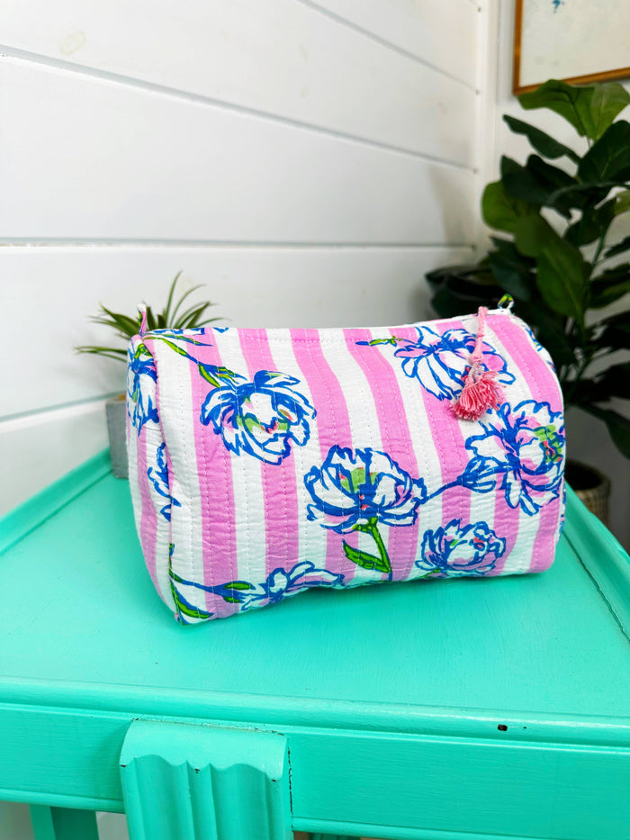 Quilted makeup bags in peony pink stripe design, showcasing a stylish cosmetics pouch by Folklore Couture.
