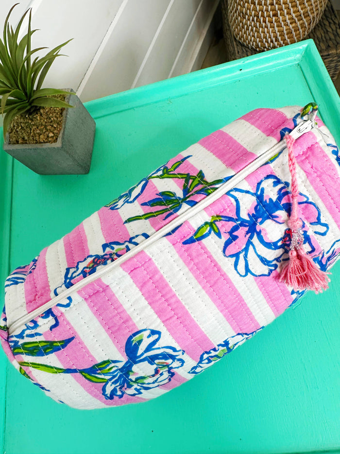 Quilted makeup pouch in peony pink stripe by Folklore Couture, showcasing a stylish and functional design for cosmetics.