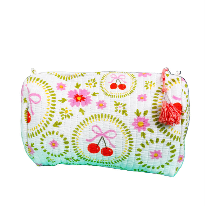 White quilted Folklore Couture cosmetics pouch with cherry and bow embroidery, perfect for makeup storage.