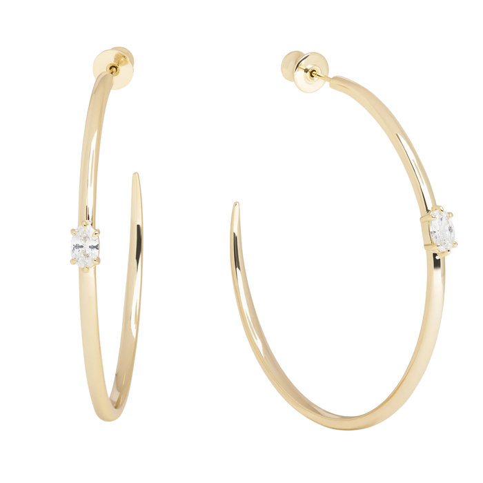 Melinda Maria She's on Point Hoops 2-inch gold earrings with a sleek, modern design and hoop style.
