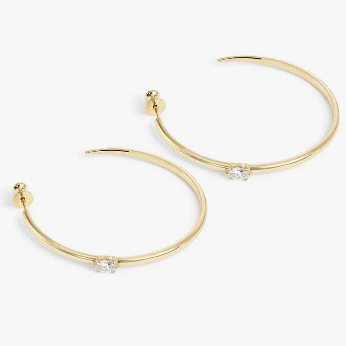 Melinda Maria She's on Point Hoops 2-inch gold earrings with sleek, modern hoop design, perfect for stylish accessories.