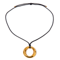 Simple round cutout titanium necklace from Private Label with a sleek, minimalist design, featuring a circular pendant on a delicate chain.