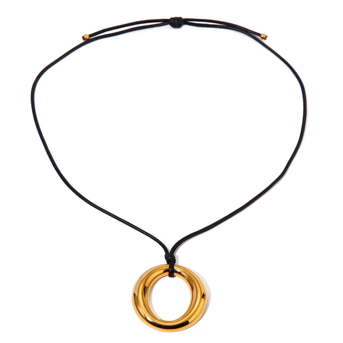 Simple round cutout titanium necklace from Private Label with a sleek, minimalist design, featuring a circular pendant on a delicate chain.