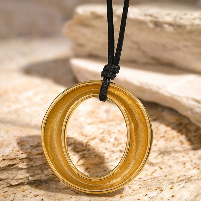 Simple round cutout titanium necklace featuring a minimalist design and sleek finish, perfect for everyday wear.