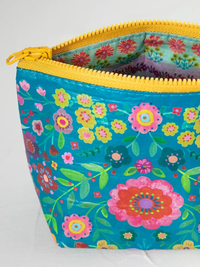 Small recycled zipper pouch by Natural Life, colorful fabric bag with zipper closure, eco-friendly and stylish accessory.