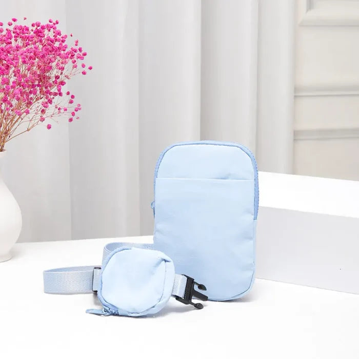 Black solid nylon sling bag with adjustable strap and minimalist design, perfect for casual crossbody wear.