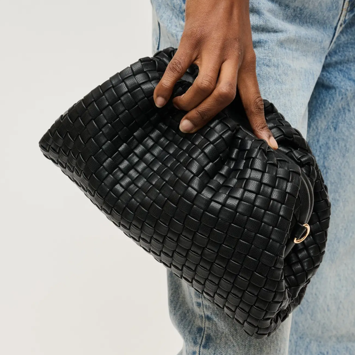 Black woven frame clutch by Urban Expressions with rhinestone hair clip accessory.