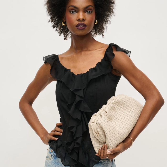 Urban Expressions Tate woven frame clutch in black with rhinestone hair clip accessory for elegant evening wear.
