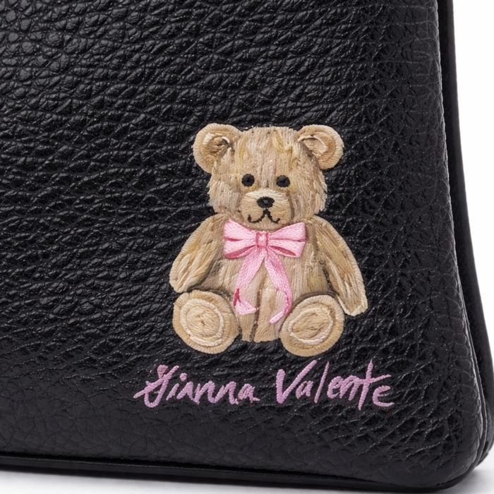 Hand-painted wristlet from Gianna Valente x Lets Bag It collection featuring vibrant floral artwork and a stylish compact design.