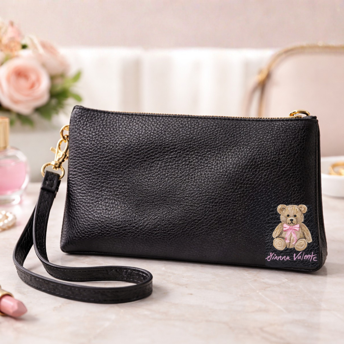Hand-painted Gianna Valente x Lets Bag It wristlets from the collection, featuring colorful, artistic designs on small leather accessories.