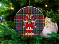 Thornton Scottish clan ceramic ornament with family crest on a Caledonia tartan background, hanging on a Christmas tree